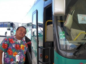 Cancun Mexico airport Apple Vacations employee in uniform waiting to take you to your resort